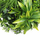 Slimline white artificial green wall disc with white frame, UV resistant flowering greenery for living wall decor by Designer Plants USA.