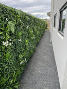 Snowy white artificial vertical garden panel by Designer Plants USA, UV-resistant living wall for commercial or home use.