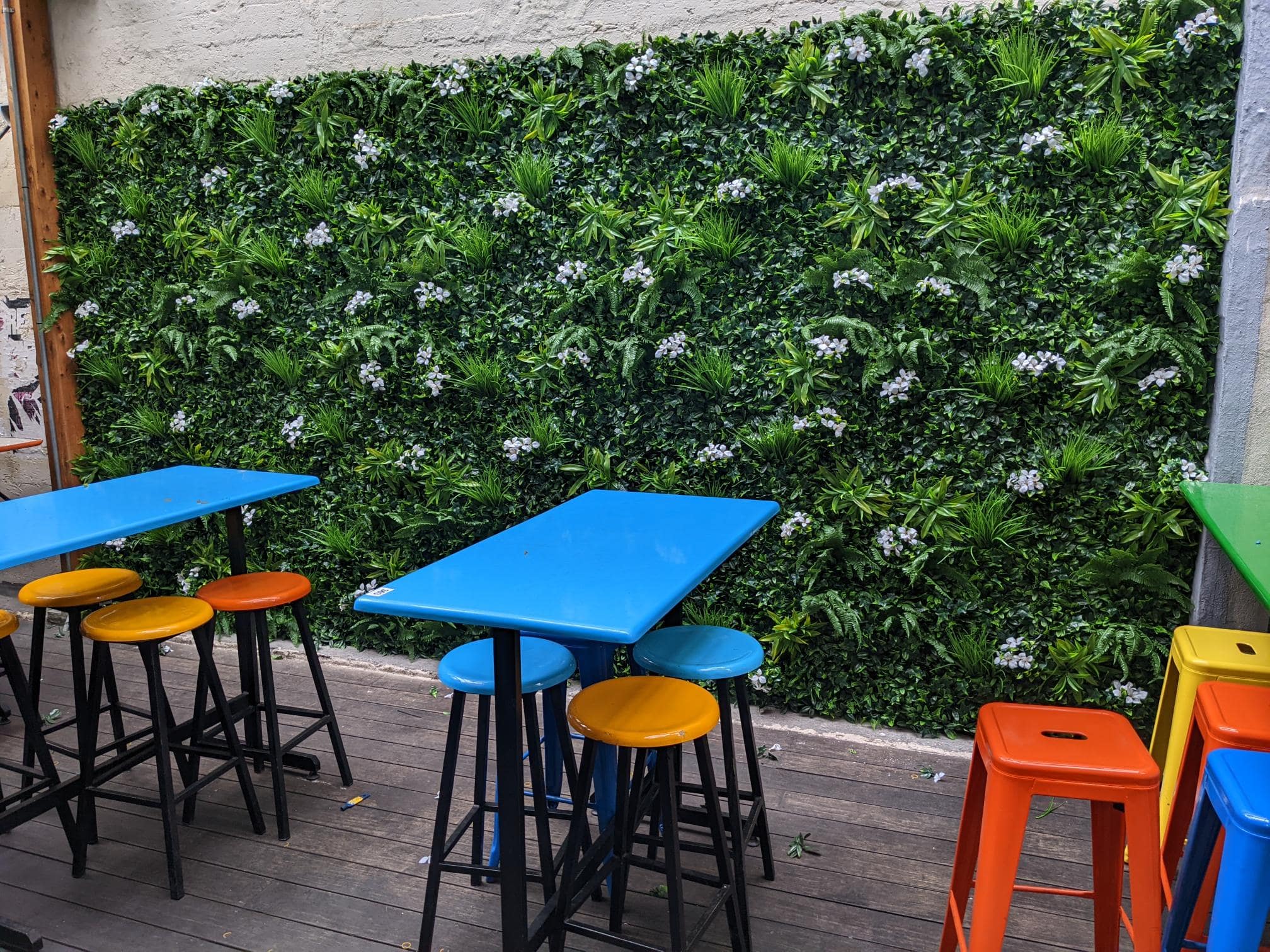 Snowy white artificial vertical garden wall panel by Designer Plants USA, UV resistant living wall for commercial use, 40x40 inches.