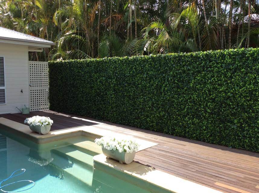 Artificial vertical garden panel by Designer Plants USA featuring lush green living wall with UV-resistant, commercial-grade design.