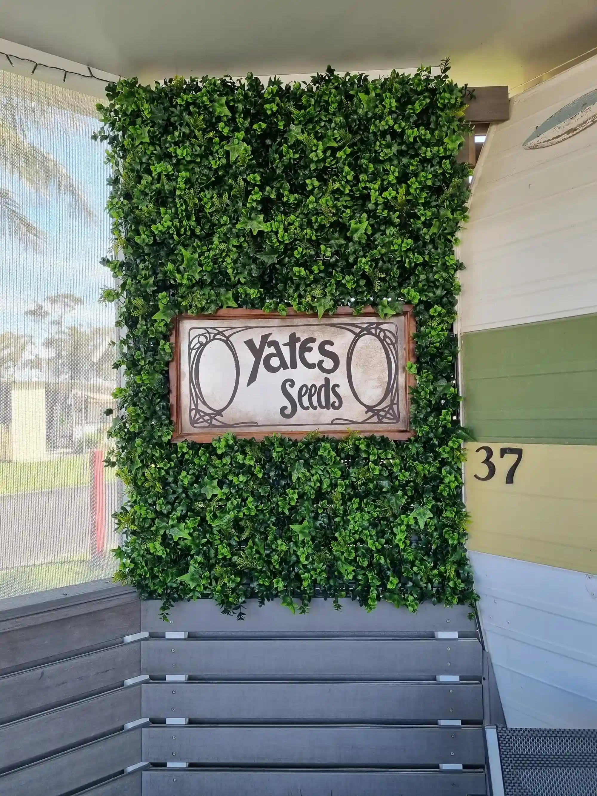 Vertical garden green wall panel by Designer Plants USA, 40x40 inches, UV resistant artificial living wall for commercial use.