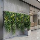 Artificial tropical green wall panel by Designer Plants USA, 35x35 inches, UV resistant, fire-rated living wall for commercial spaces.