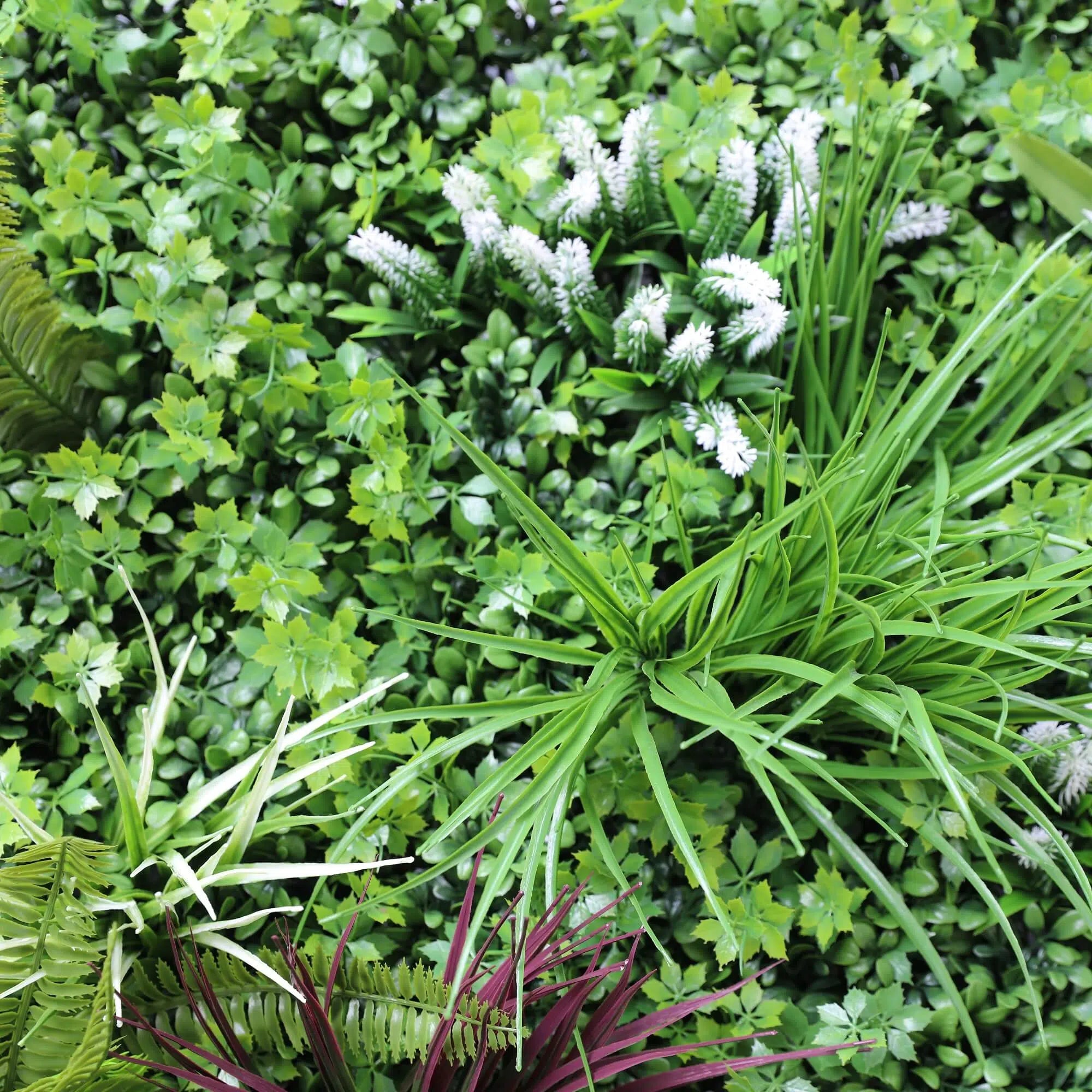 Artificial tropical vista green wall panel by Designer Plants USA, UV-resistant living wall with lush faux grasses in 40x40 inch size.