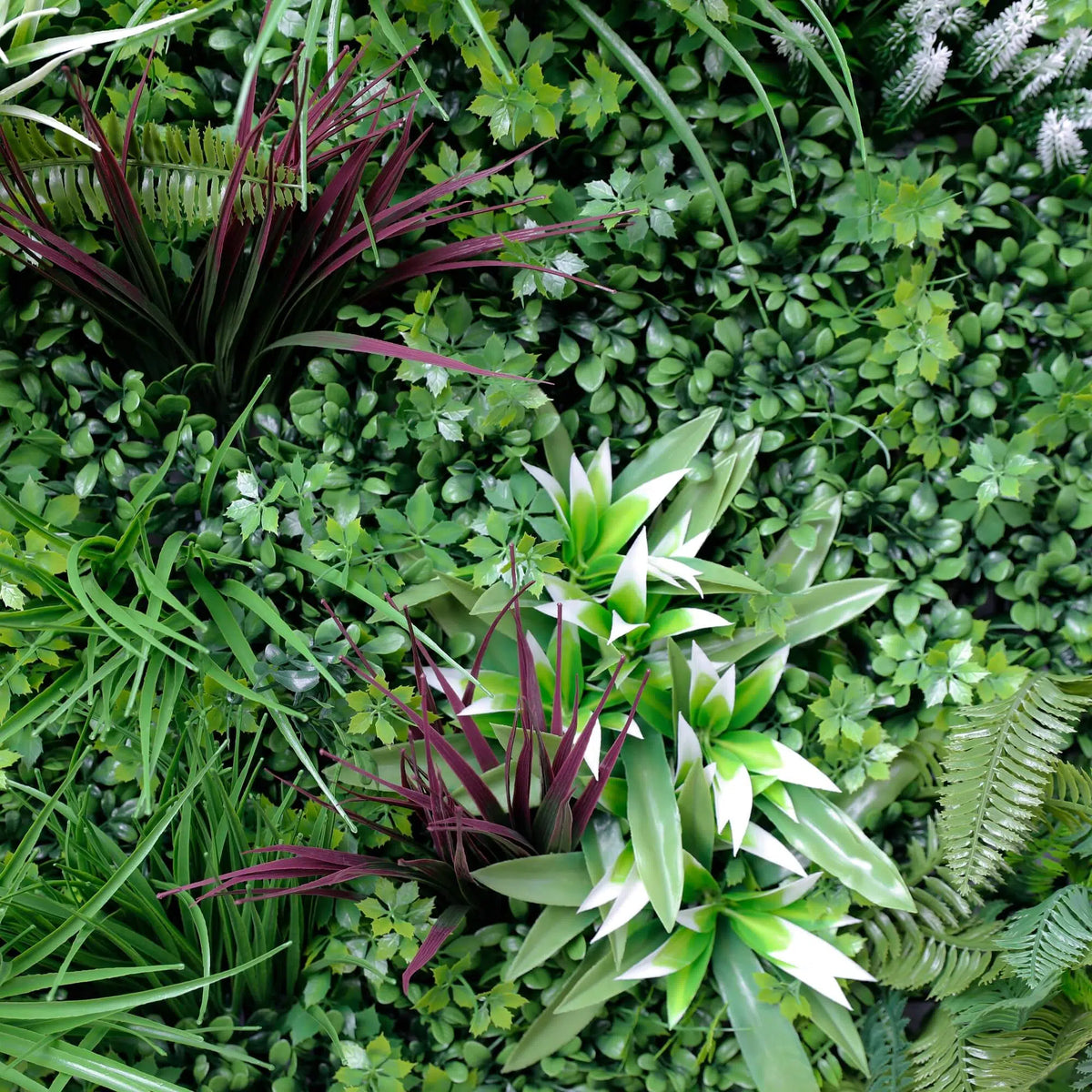 Artificial tropical vista green wall panel with lush greenery and brown grasses, UV resistant, designed for living walls.
