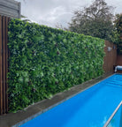 Artificial tropical Vista vertical garden panel by Designer Plants USA, UV resistant green wall with lush foliage, 40x40 inches.