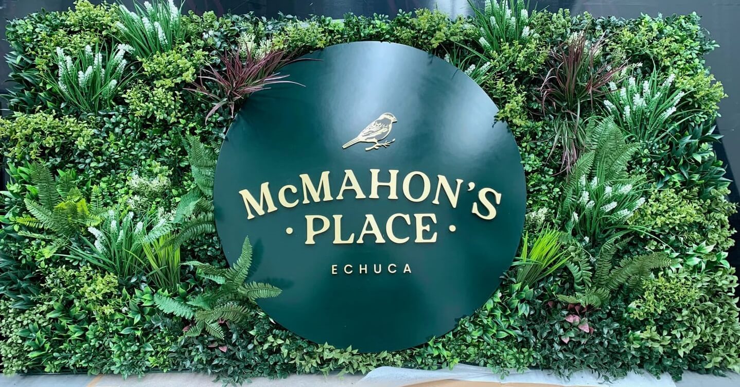 Artificial green wall panel from Tropical Vista by Designer Plants USA, ideal for commercial living wall signage, UV resistant, 40x40 inches