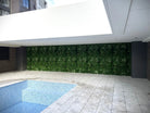 Artificial tropical vista green wall panel by Designer Plants USA, 40x40 inch living wall with UV-resistant, lush tropical plant design.