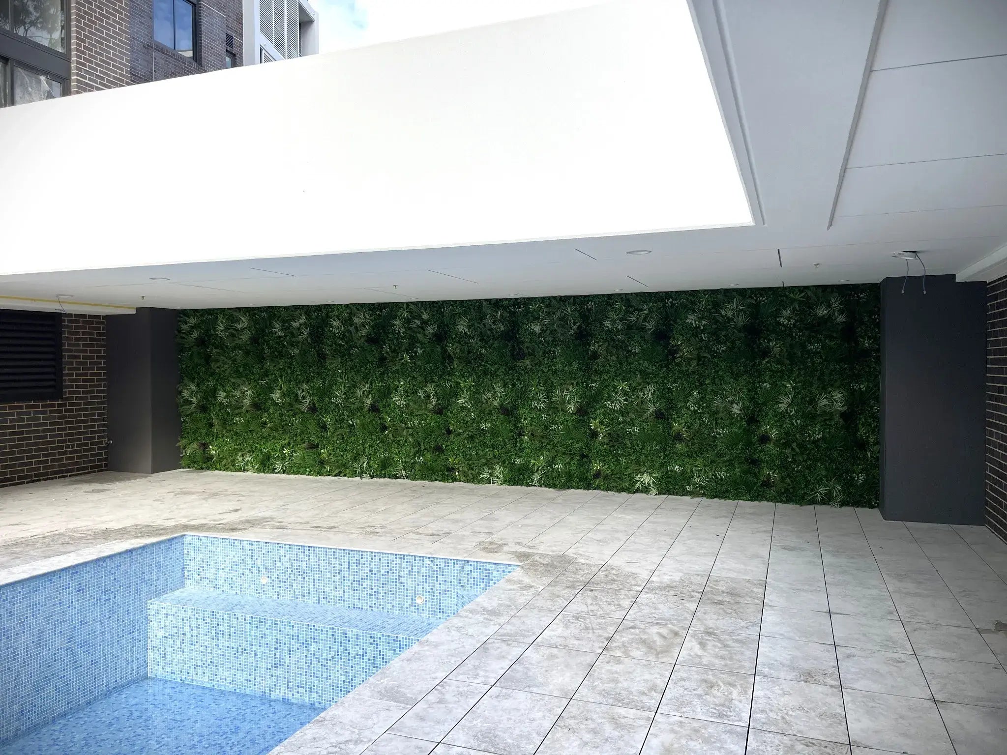 Artificial tropical vista green wall panel by Designer Plants USA, 40x40 inch living wall with UV-resistant, lush tropical plant design.