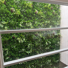 Tropical Vista artificial vertical garden green wall panel by Designer Plants USA, UV-resistant, 40x40 inches, 11 sq ft, for living walls.