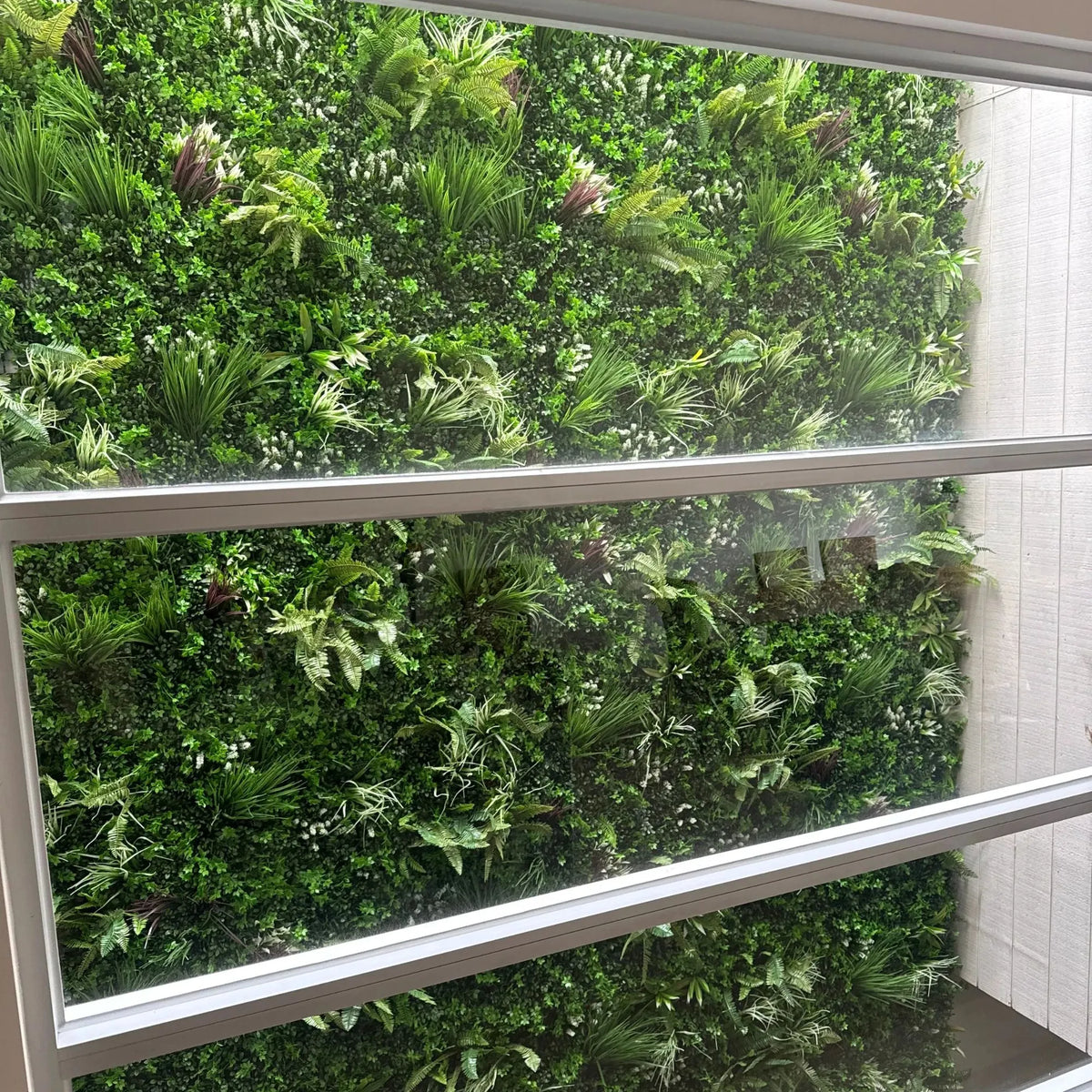 Tropical Vista artificial vertical garden green wall panel by Designer Plants USA, UV-resistant, 40x40 inches, 11 sq ft, for living walls.