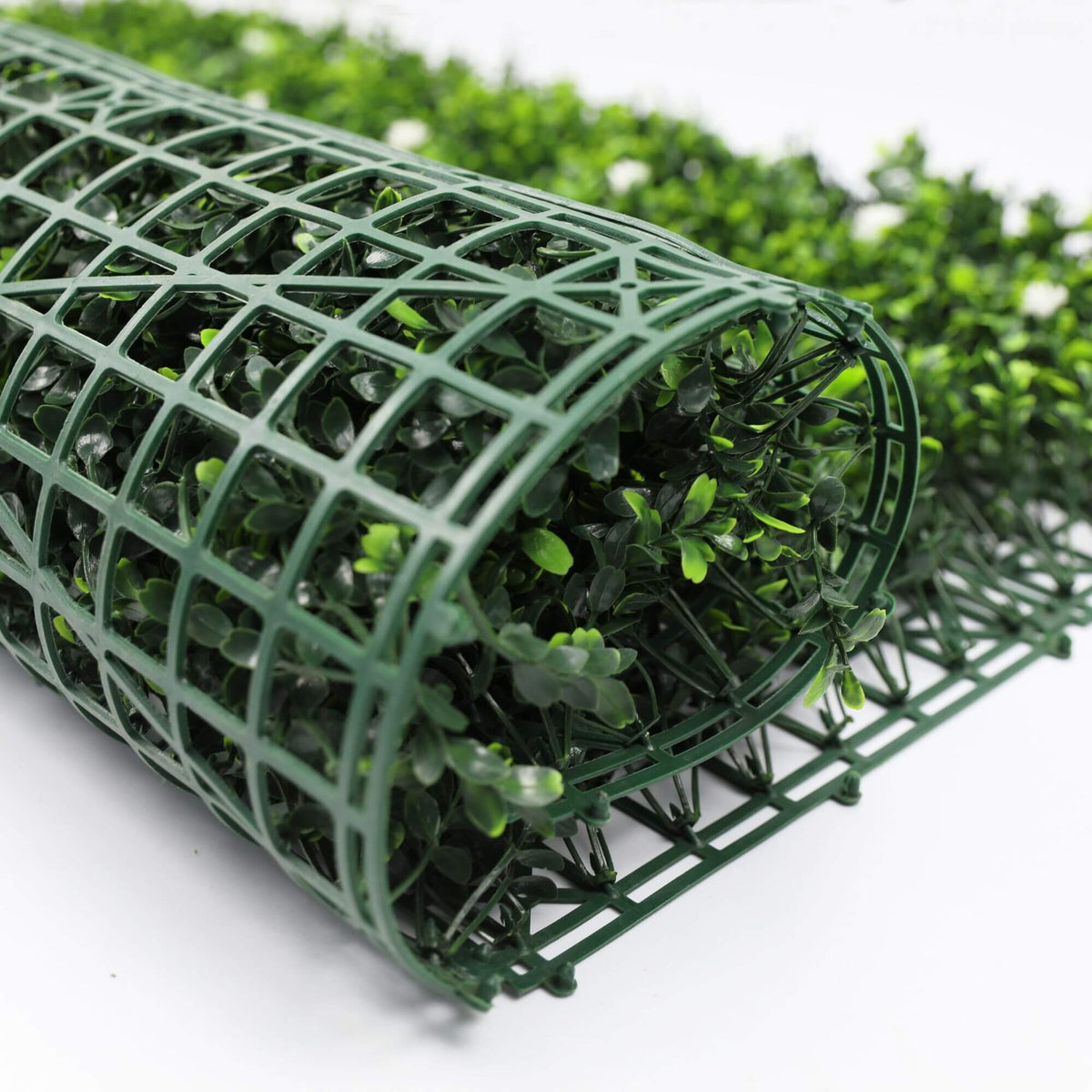 White flowering artificial boxwood hedge panel from Designer Plants USA, UV-resistant living wall for vertical garden decoration.