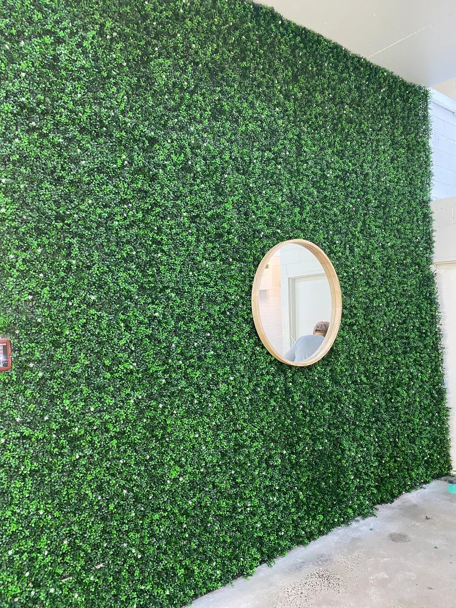 White flowering boxwood artificial vertical garden panel from Designer Plants USA, UV resistant living wall for commercial or home use.