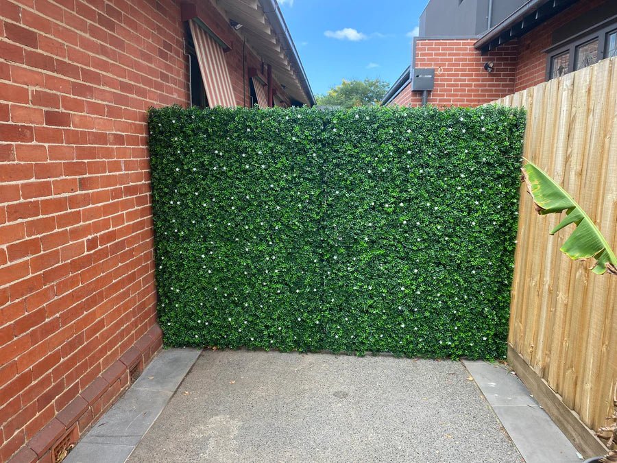 White flowering boxwood artificial vertical garden panel from Designer Plants USA, UV resistant, 40x40 inch living wall for commercial use.