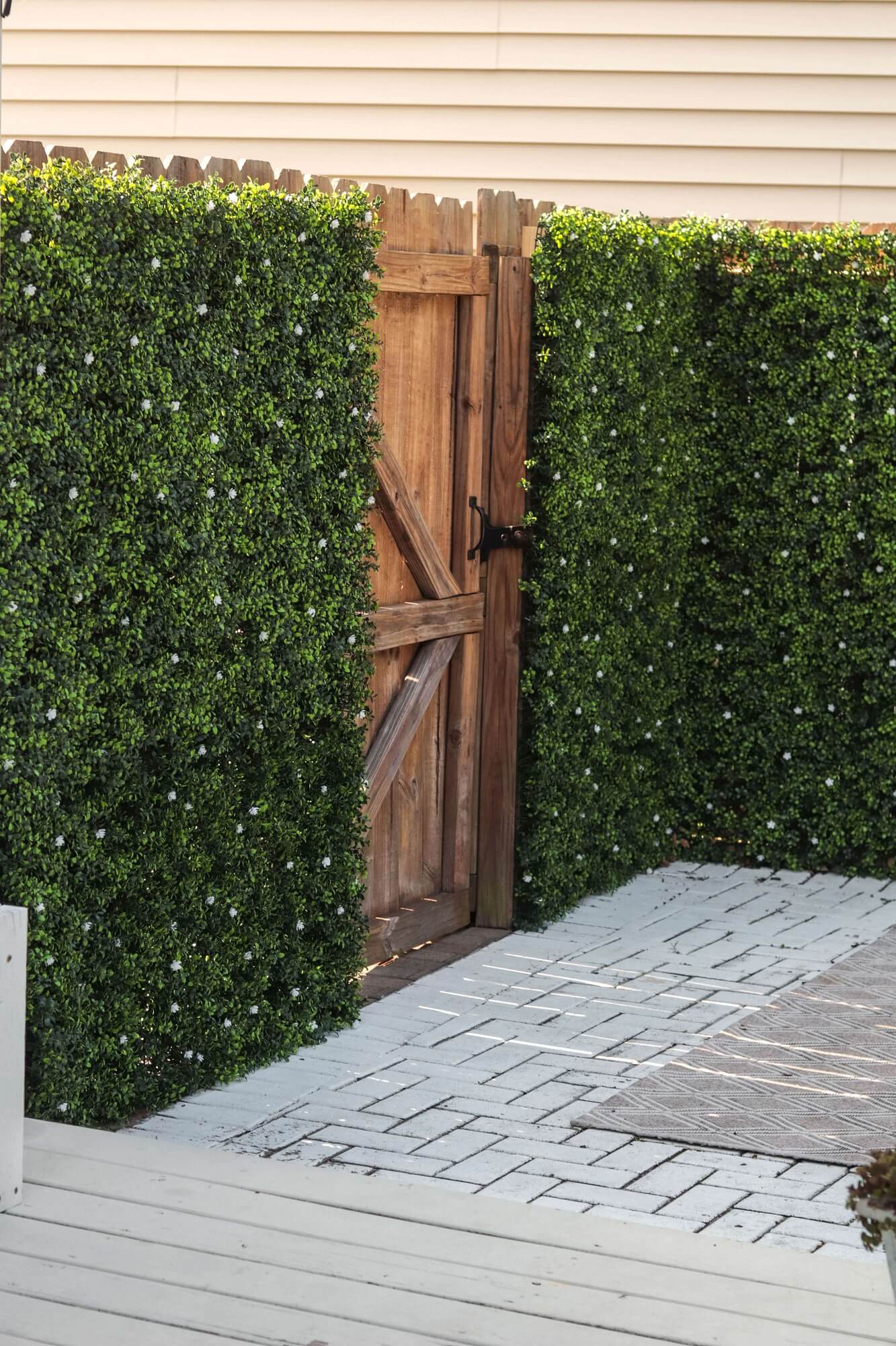White flowering artificial boxwood hedge panel for living walls, UV resistant, 40x40 inches, commercial grade by Designer Plants USA.