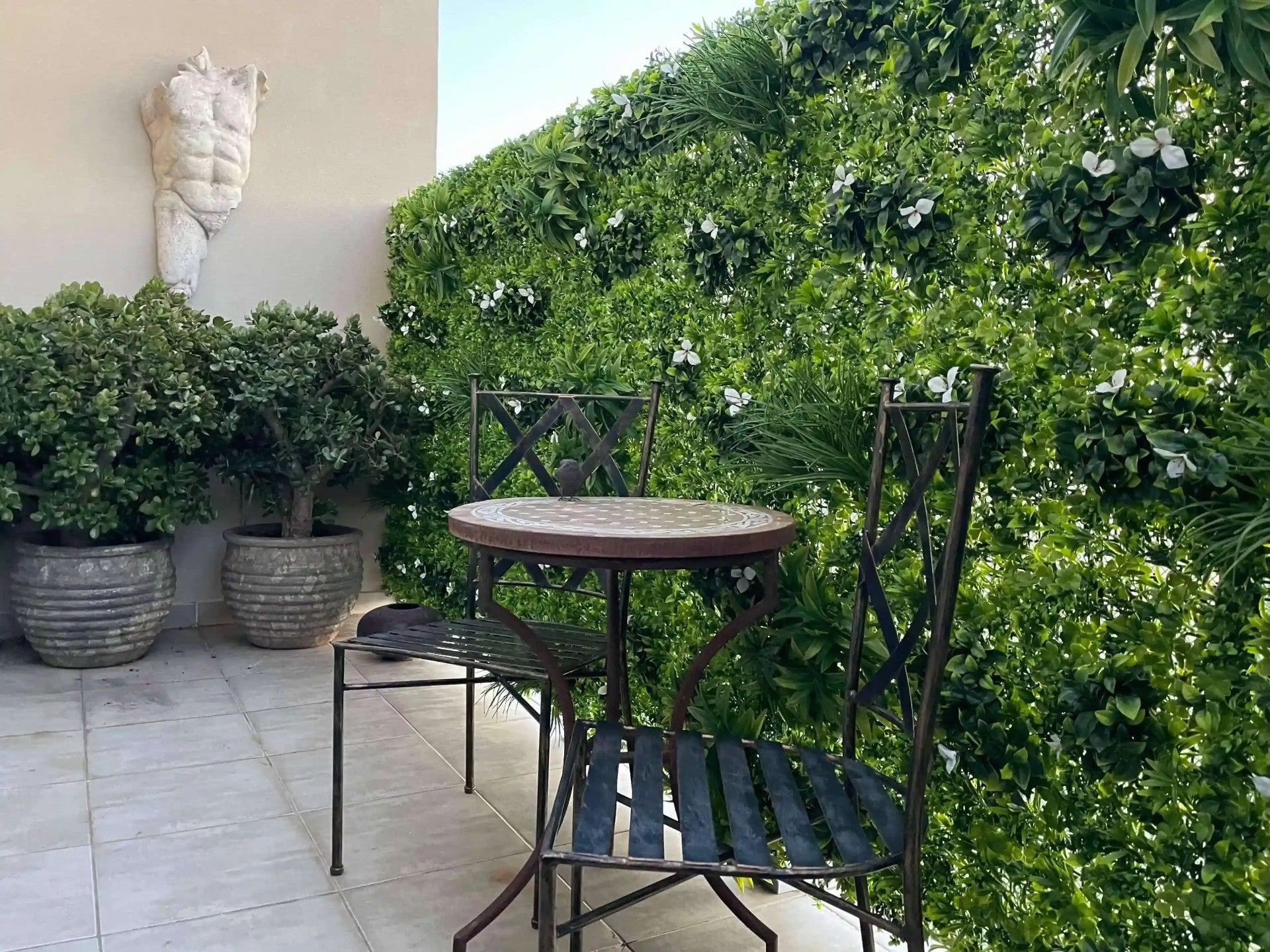 Artificial white oasis vertical garden panel by Designer Plants USA, UV-resistant living wall for balconies and outdoor spaces.