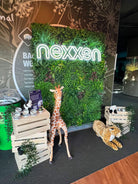 Small sample of Designer Plants USA Country Fern vertical garden panel with artificial greenery and LED signage display.