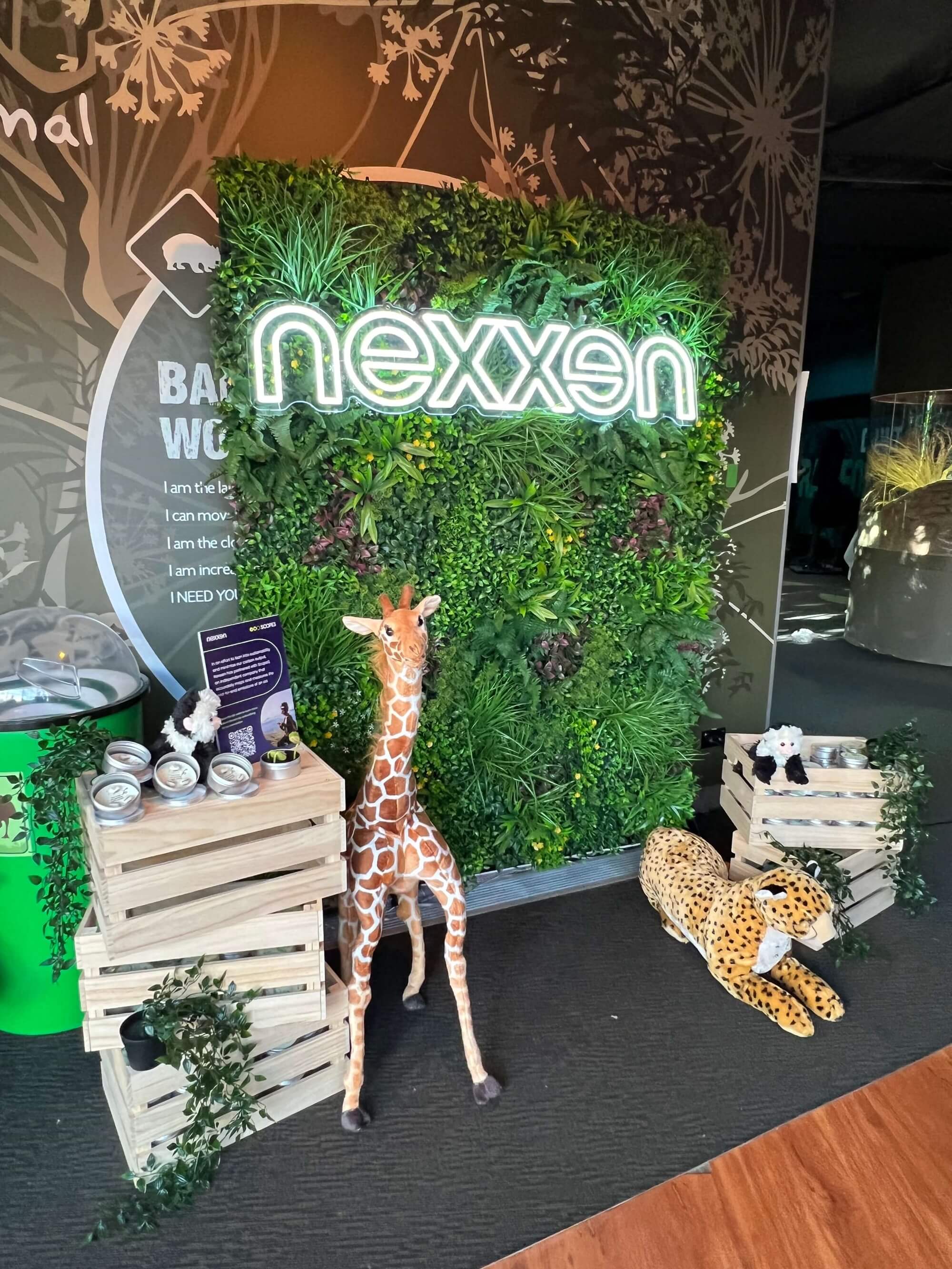 Small sample of Designer Plants USA Country Fern vertical garden panel with artificial greenery and LED signage display.