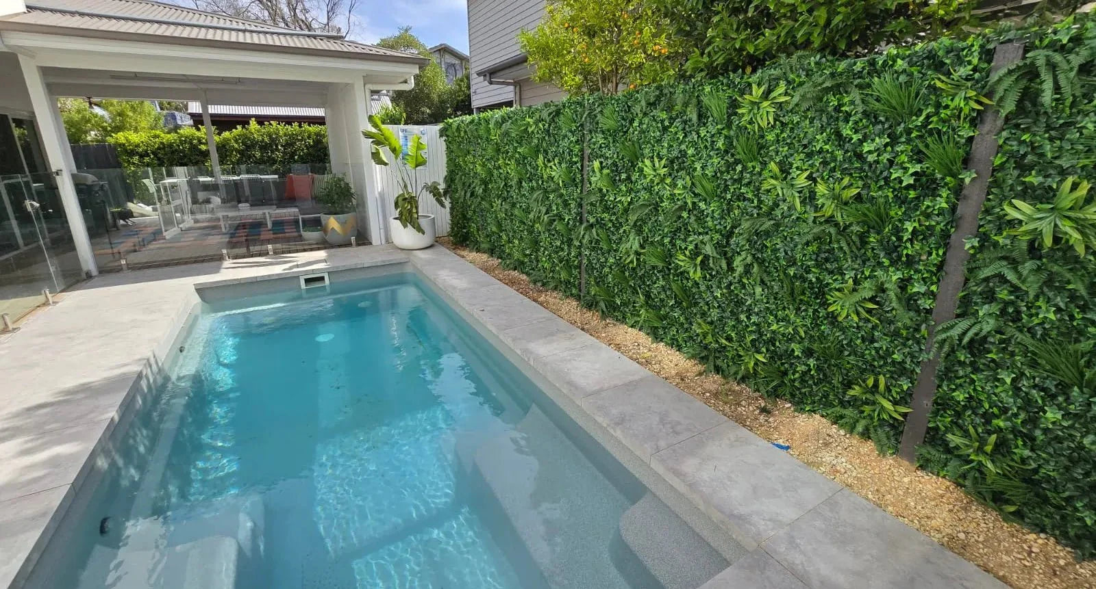 Small sample of Designer Plants USA Green Tropics vertical garden panel featuring lush artificial green wall foliage.