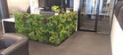 Small sample of Designer Plants USA Lush Spring Vertical Garden panel used as office desk dividing wall with artificial greenery.