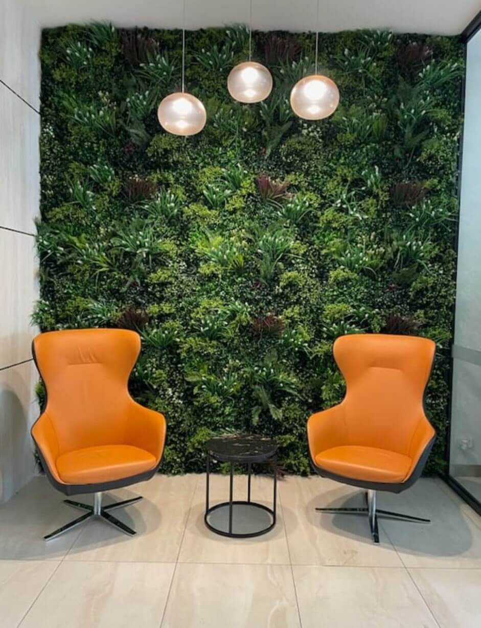 Small sample of Designer Plants USA Lush Spring Vertical Garden panel showing green wall in an office waiting room.