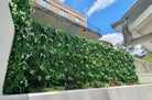 Small sample of Designer Plants USA Snowy White Vertical Garden panel showing artificial greenery and clean white design.