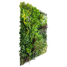 Small sample of Designer Plants USA urban greenery vertical garden with artificial green wall and red grasses, side view.