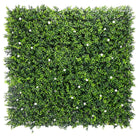 Small sample of Designer Plants USA white flowering boxwood green wall panel with lush artificial flowering boxwood hedge.