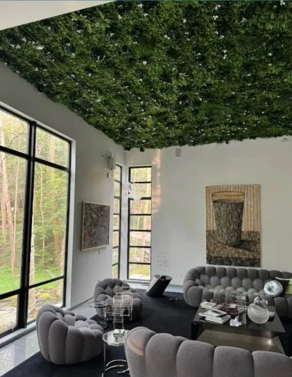 Small white Oasis vertical garden sample by Designer Plants USA with artificial green wall on ceiling.
