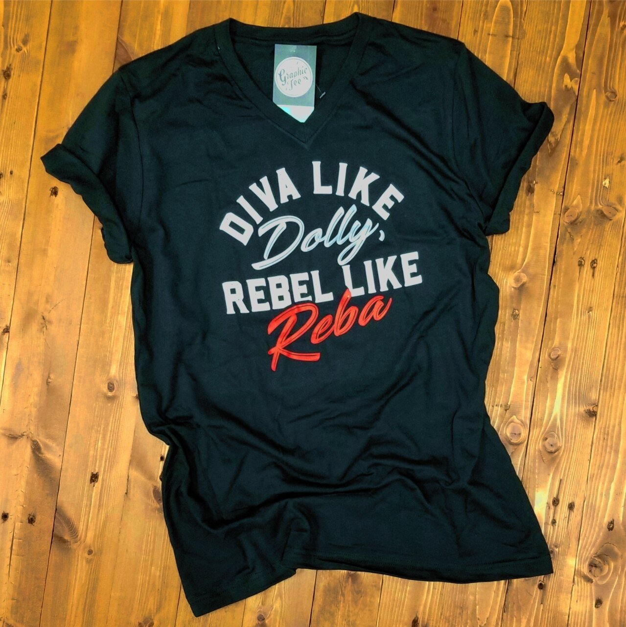 Vintage black graphic T-shirt featuring Diva Like Dolly and Rebel Like Reba designs by The Graphic Tee.