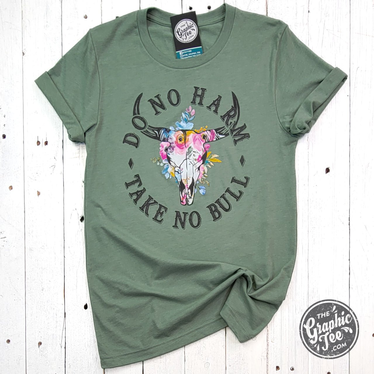 Heather sage crewneck short sleeve tee with graphic design saying "Do No Harm Take No Bull" by The Graphic Tee.