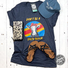 Heather midnight navy graphic t-shirt with "Don't Be A Salty Heifer" slogan from The Graphic Tee, casual unisex style.