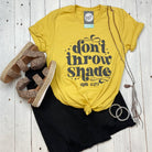 Maize yellow crew neck graphic tee from The Graphic Tee featuring a bold "Don't Throw Shade" design on short sleeves.