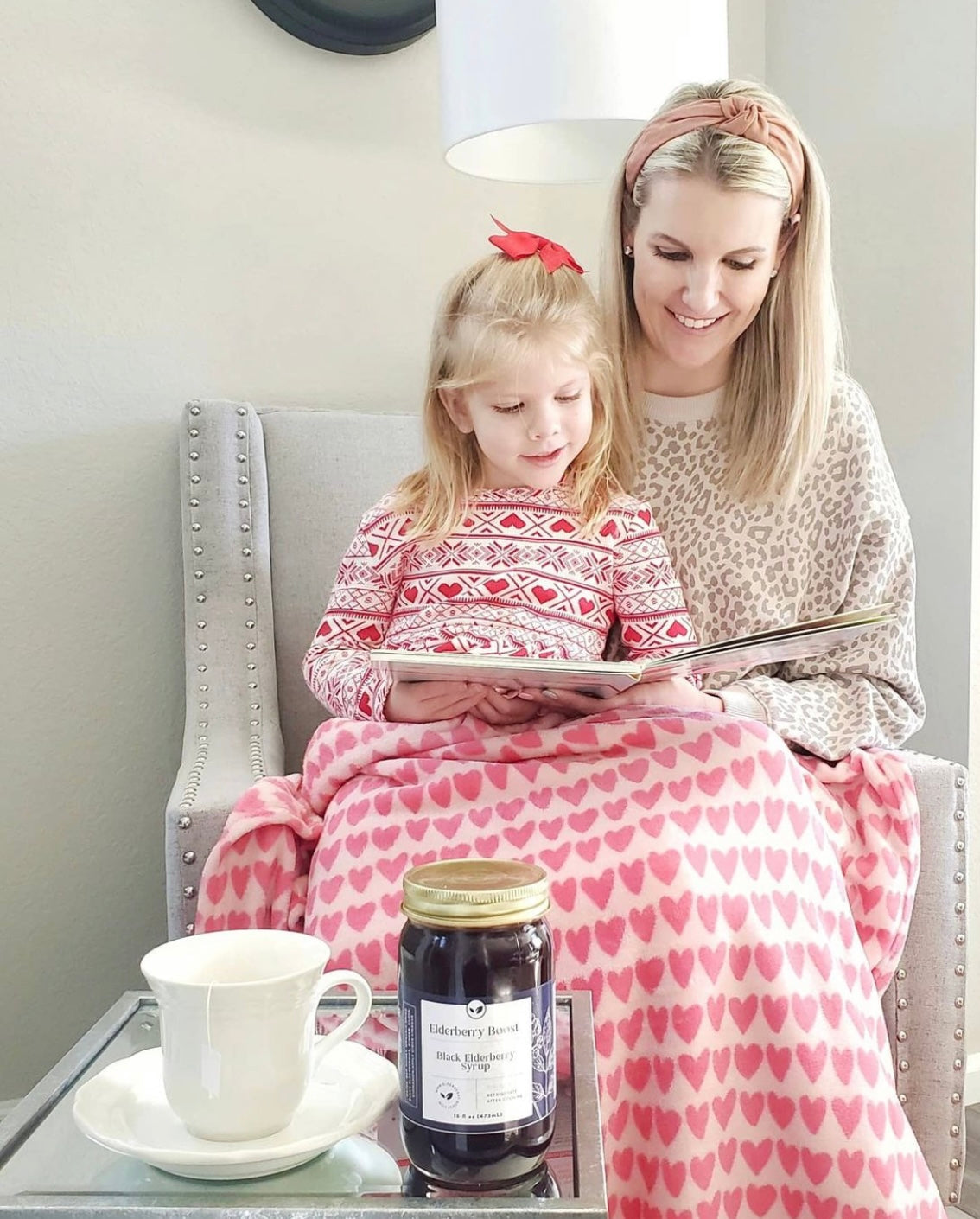 All-natural Elderberry Boost syrup in a 16 oz bottle, featuring dark elderberries and natural ingredients for immune support.