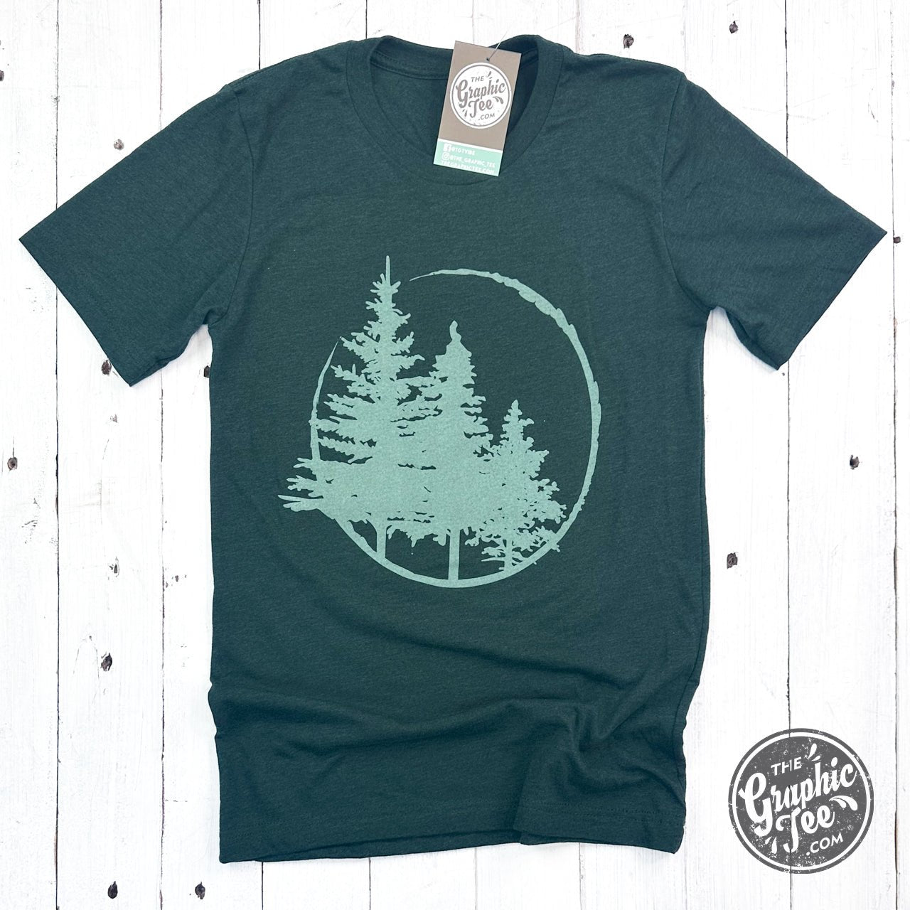 Evergreens Heather Emerald short sleeve graphic tee by The Graphic Tee, soft fabric with a colorful nature-inspired design.