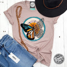 Heather pink short sleeve graphic tee with a fall butterfly design from The Graphic Tee, casual and stylish for everyday wear.