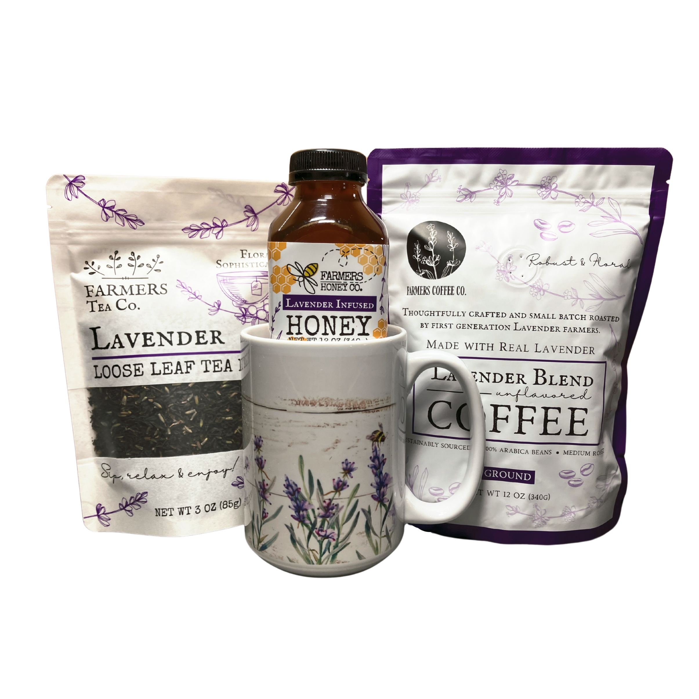 Farmers Lavender Co. gift box with lavender, coffee, tea, and honey arranged inside on a rustic wooden surface.