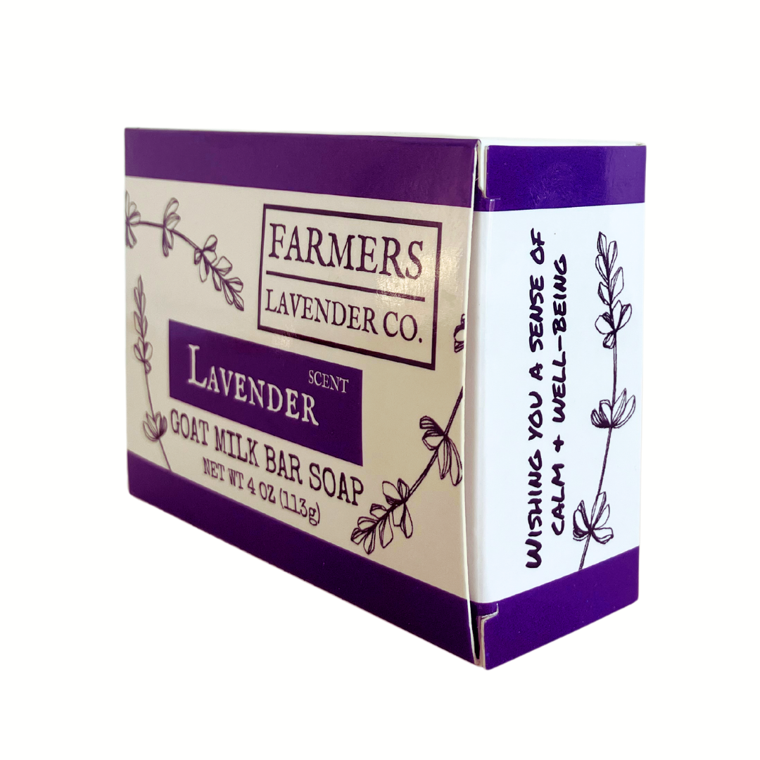 Lavender goat milk bar soap by FARMERS Lavender Co. showing a white soap bar with lavender accents and packaging.