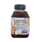 Jar of lavender-infused honey from FARMERS Lavender Co., showcasing golden honey with lavender flowers.