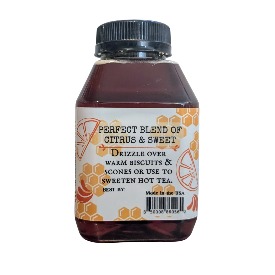 Jar of orange-infused honey from FARMERS Lavender Co., showing golden honey with orange infusion and natural label.