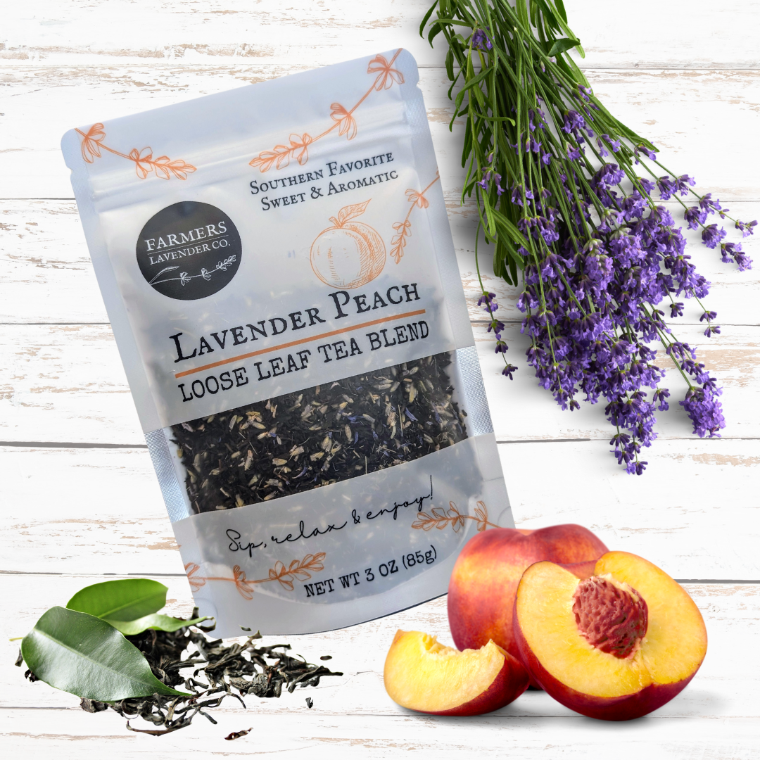 Loose leaf Lavender Peach Tea blend by FARMERS Lavender Co., showing dried lavender flowers and peach-infused tea leaves.