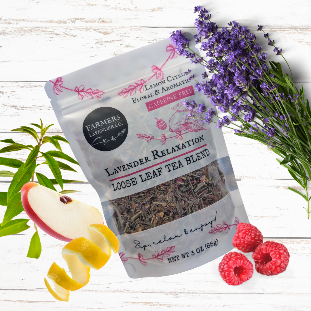 Loose leaf Lavender Relaxation Tea blend by FARMERS Lavender Co., showing dried lavender and tea leaves in a natural setting.