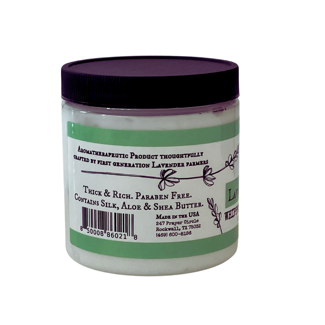 Lavender Mint Whipped Body Butter from FARMERS Lavender Co. displayed in a jar with a creamy, fluffy texture and fresh lavender sprigs.