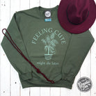 Feeling Cute Might Die Later crewneck sweatshirt from The Graphic Tee, featuring a cozy, casual design with playful text.