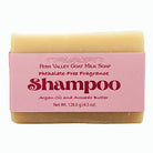 Handmade goat milk shampoo bar with argan oil and avocado butter, featuring a flirty floral scent in Fern Valley Soap packaging.