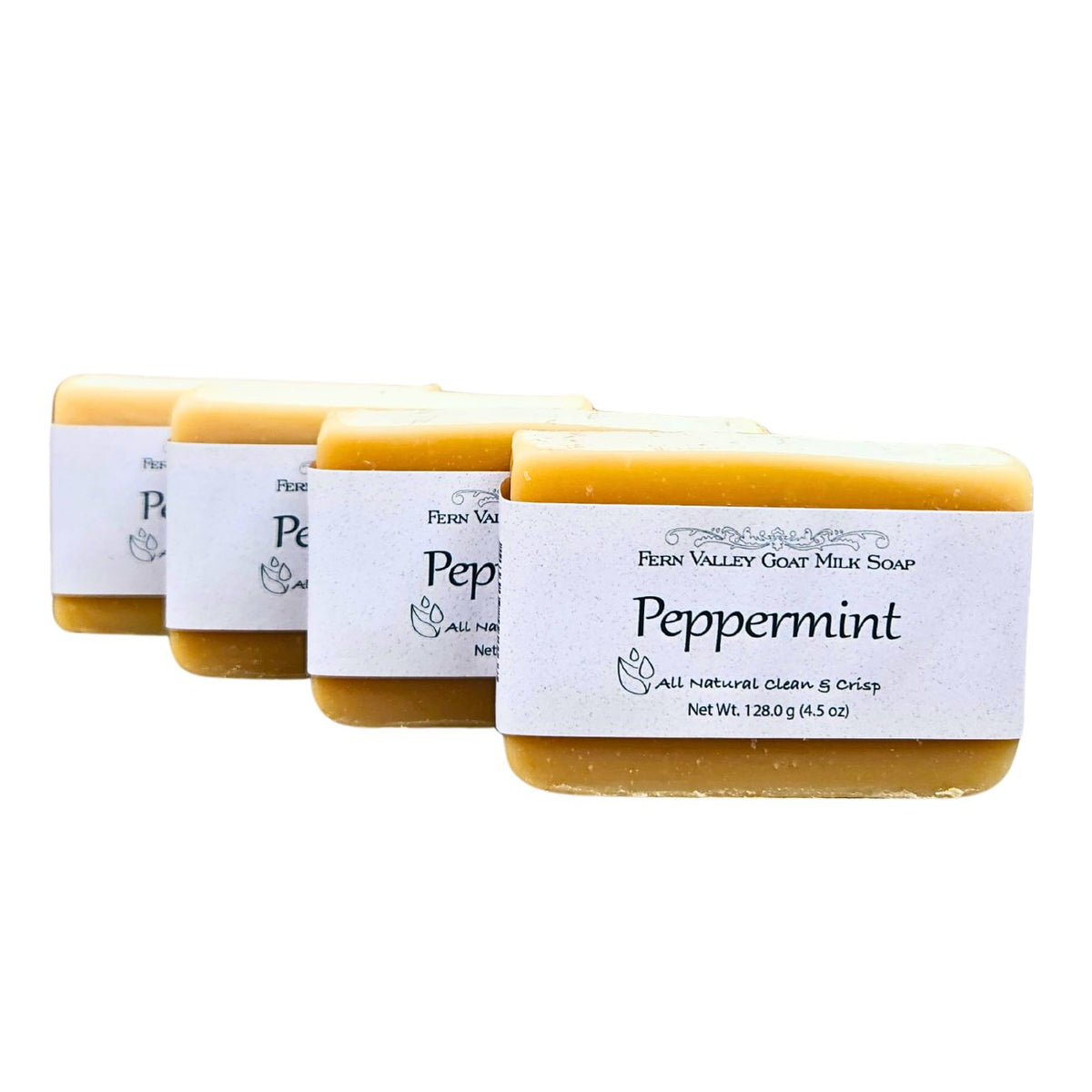 Handmade Fern Valley Goat Milk Soap with natural peppermint scent, featuring a pale green bar with peppermint swirls.