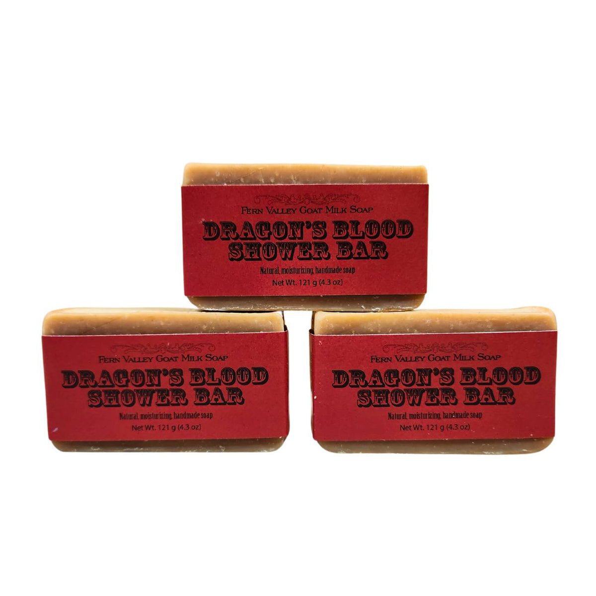Fern Valley Goat Milk Soap shower bar with dragon's blood scent, featuring creamy texture and natural ingredients, displayed on a wooden surface.