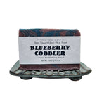 Fern Valley Goat Milk Soap with blueberry cobbler exfoliating scrub, featuring fresh blueberries and creamy soap texture.