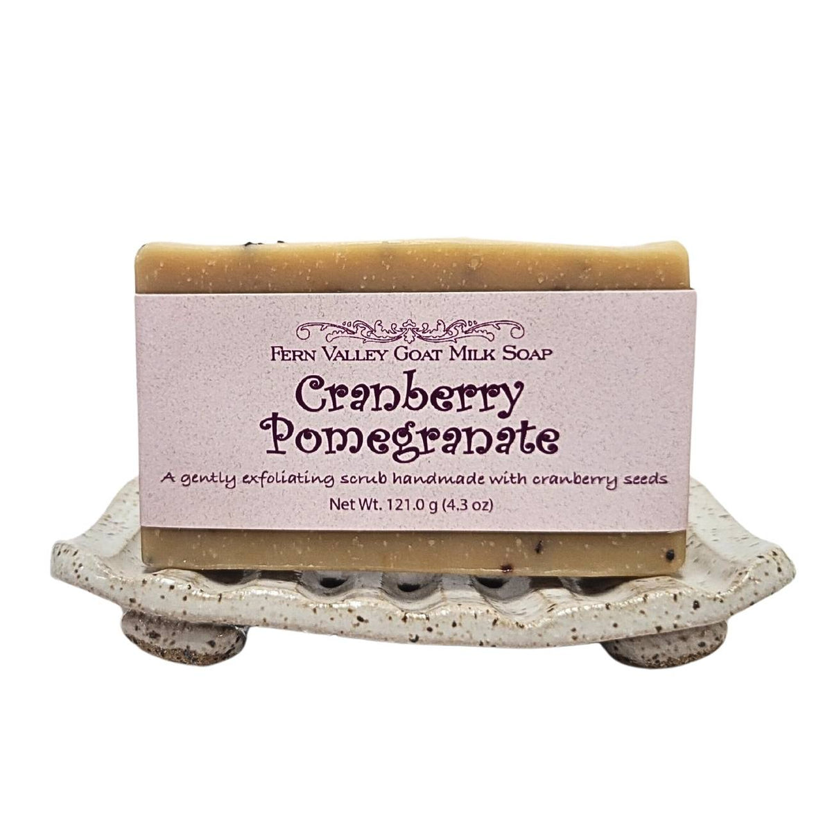 Fern Valley Goat Milk Soap with cranberry pomegranate exfoliating scrub, showcasing a vibrant, textured soap bar with fresh fruit accents.
