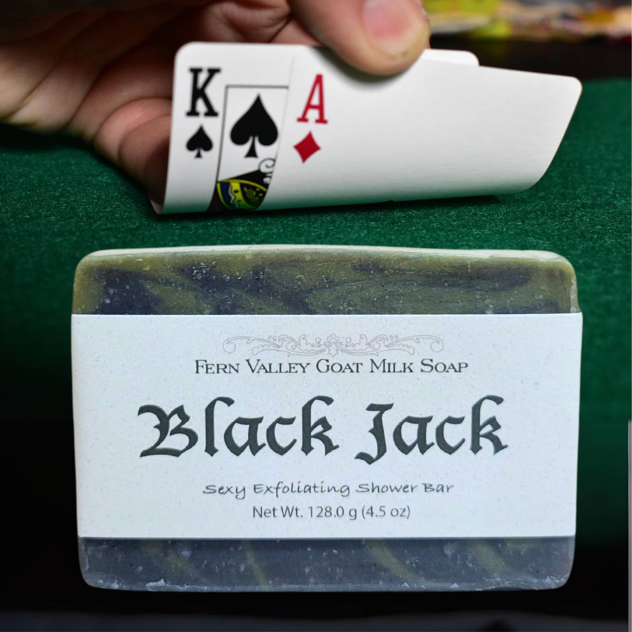 Fern Valley Soap Black Jack goat milk soap bar, exfoliating men's scrub with natural ingredients, in black packaging.