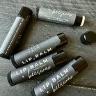 Unboxed Five Oaks Farm beeswax unscented lip balm showing the small jar with natural beeswax texture and label.